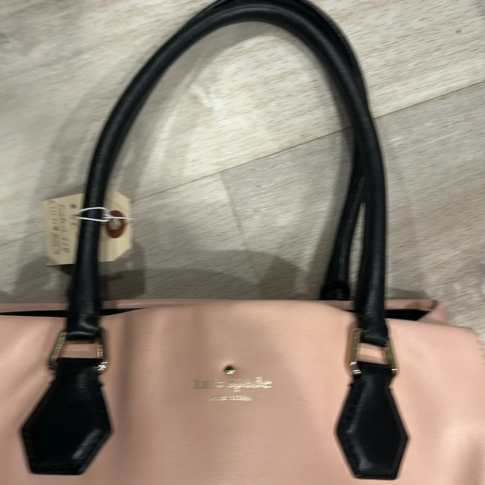 Kate Spade pink soft hobo bag, inside off-white and black bowties good used con.